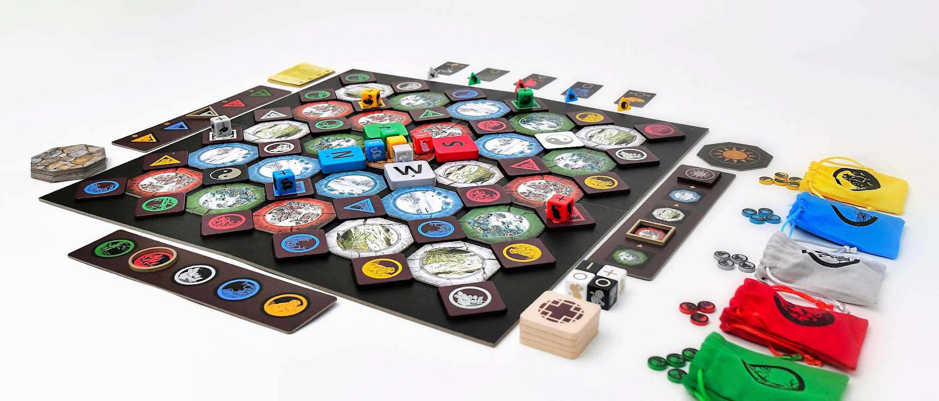The complete First Edition setup with illustrated tiles, wooden pieces, animal cards, chi tokens and colored bags