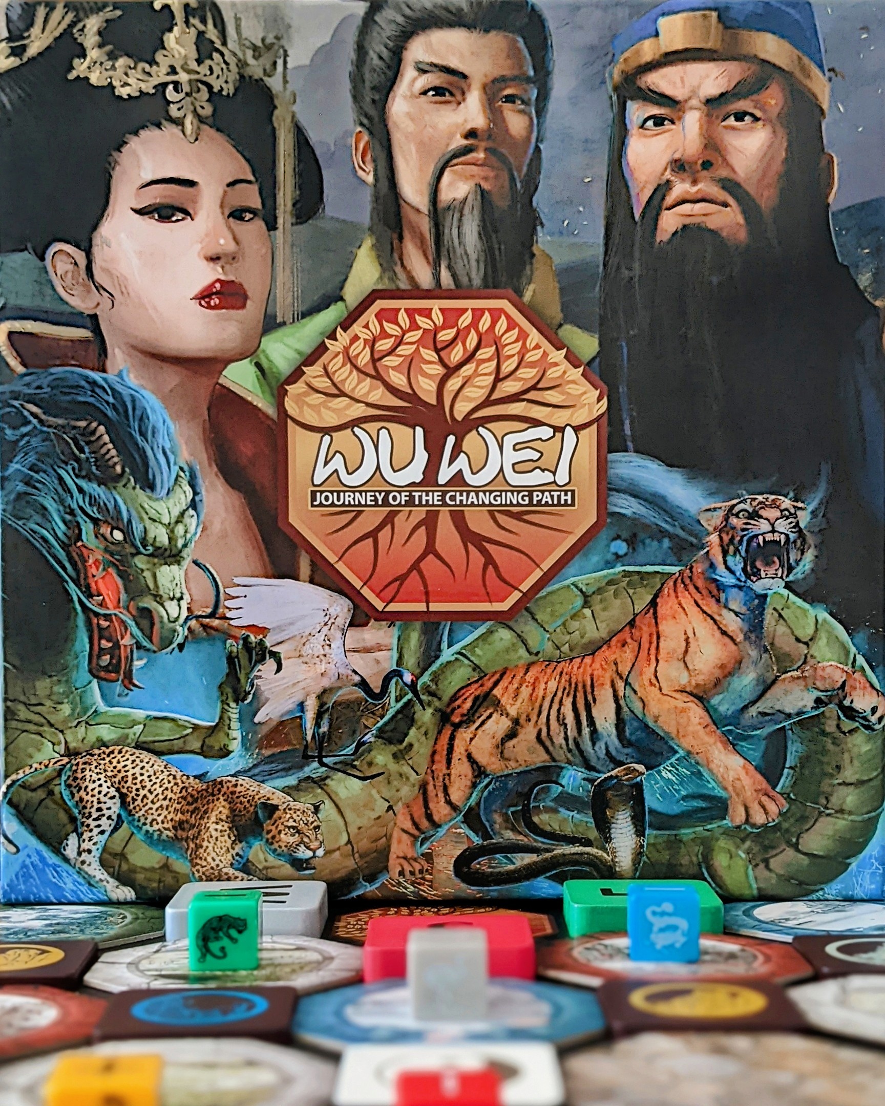 Close up of front of Wu Wei box with a bit of the board game in the forefront of the photo.